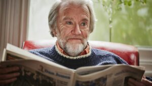 Senior man reading newspaper